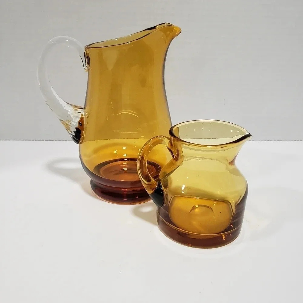 Vintage set if 2 Amber Glass Pitchers.